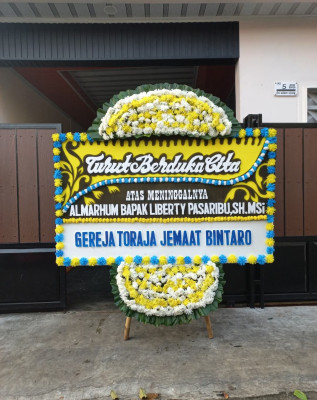 Papan Bunga Duka di Katulisan